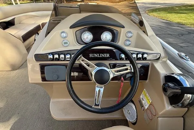 Slide: The Image of 2014 Harris FloteBote Sunliner 200 dashboard with steering wheel and control panel. - 7