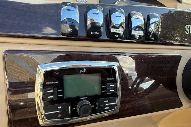 Slide: The Image of Control panel of 2014 Harris FloteBote Sunliner 200 with Polk stereo system. - 9