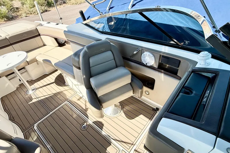 Slide: The Image of 2011 Sea Ray 270 SLX boat interior with seating and table, featuring sleek design. - 13