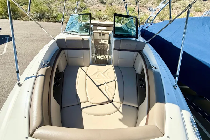 Slide: The Image of 2011 Sea Ray 270 SLX boat anchor compartment with open hatch, showing anchor and chain. - 15