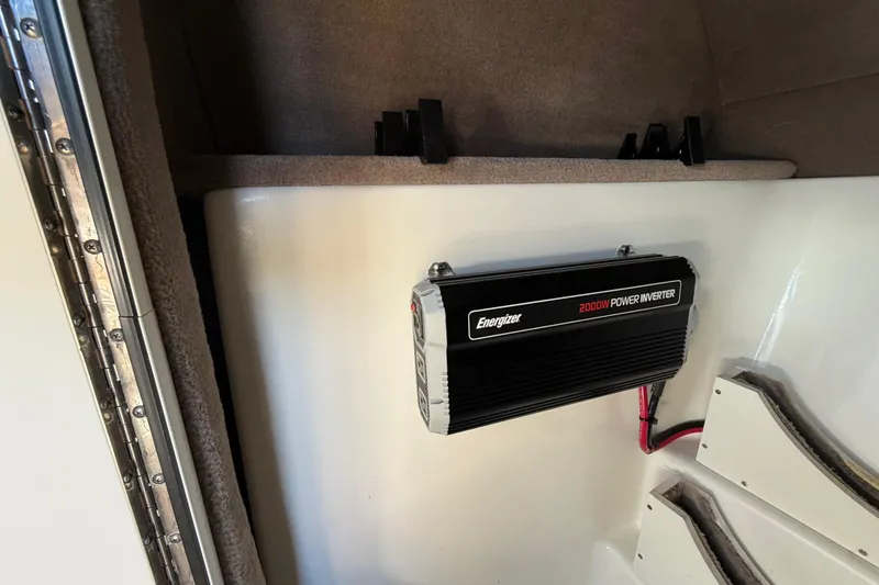 Slide: The Image of 2011 Sea Ray 270 SLX boat interior with seating and table, featuring sleek design. - 19