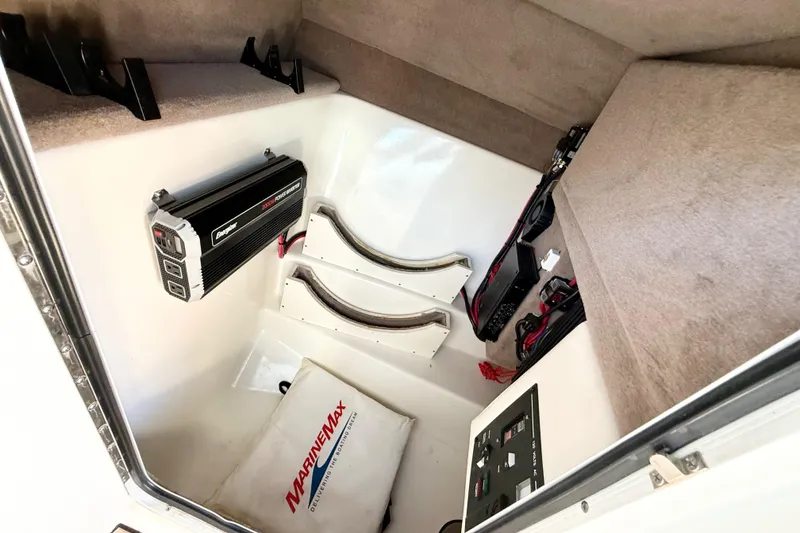 Slide: The Image of Open anchor compartment on 2011 Sea Ray 270 SLX boat, showing anchor and chain. - 22