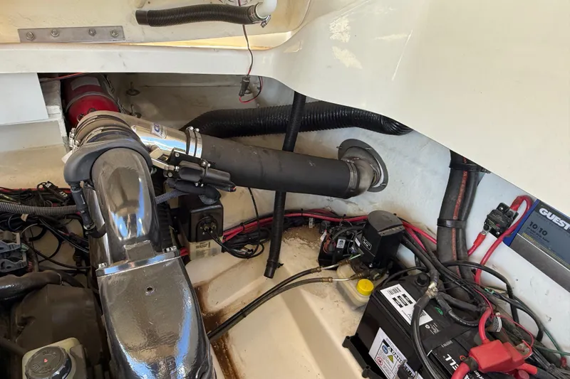 Slide: The Image of Engine compartment of a 2011 Sea Ray 270 SLX boat, showing hoses and wiring. - 32