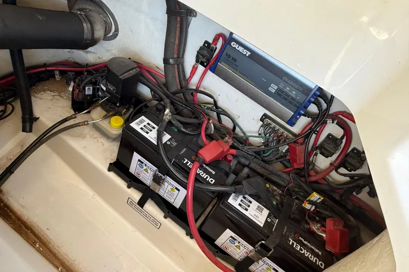 Slide: The Image of Engine compartment of a 2011 Sea Ray 270 SLX boat, showing mechanical components and wiring. - 33