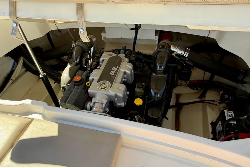 Slide: The Image of Battery compartment of a 2011 Sea Ray 270 SLX with wiring and charger. - 34
