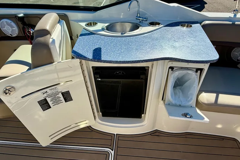 Slide: The Image of Engine compartment of a 2011 Sea Ray 270 SLX boat, showcasing the 8.2L engine. - 35