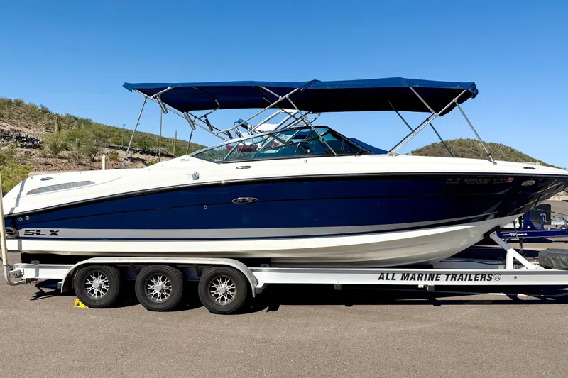 Slide: The Image of 2011 Sea Ray 270 SLX boat with spacious seating and modern interior design. - 6