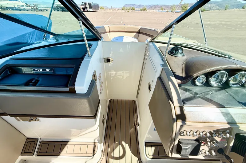 Slide: The Image of 2011 Sea Ray 270 SLX boat interior with seating and table, showcasing luxury design. - 8
