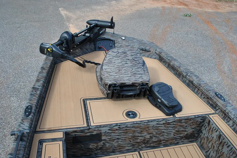Slide: The Image of 2024 Express 180XP boat deck with camouflage pattern and advanced trolling motor. - 14