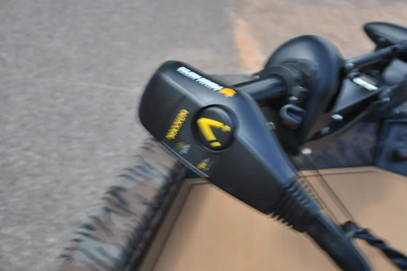 Slide: The Image of Close-up of 2024 Express 180XP boat control panel with steering mechanism. - 15