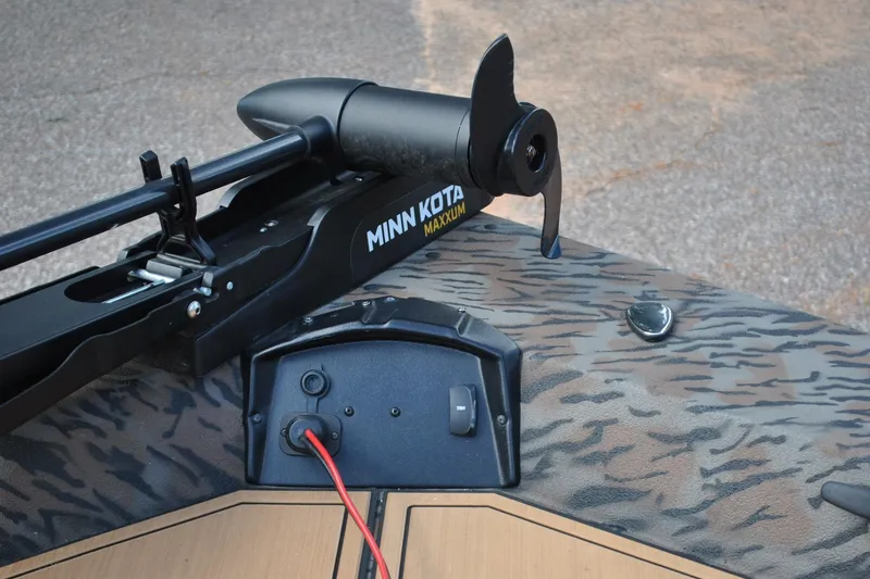 Slide: The Image of ```html Alt text: "2024 Express 180XP boat with Minn Kota Maxxum trolling motor." ``` - 16