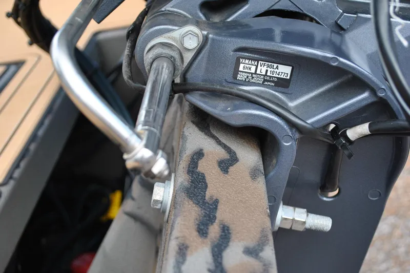 Slide: The Image of Close-up of 2024 Express 180XP boat engine with Yamaha VF90LA label. - 21