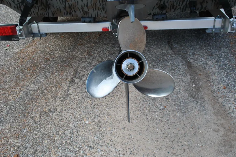 Slide: The Image of 2024 Express 180XP boat propeller on a trailer, close-up view. - 22
