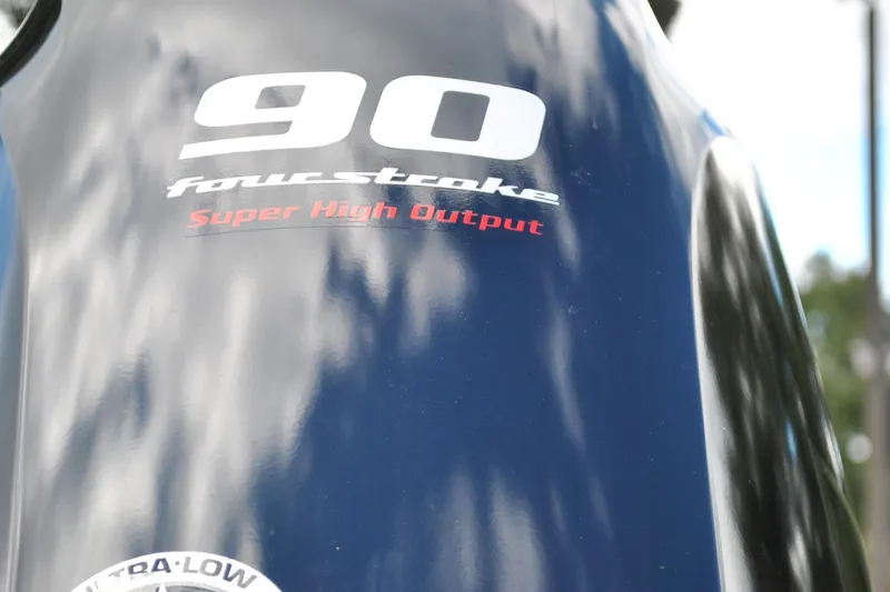 Slide: The Image of 2024 Express 180XP engine cover, featuring "90 four-stroke Super High Output" text. - 23