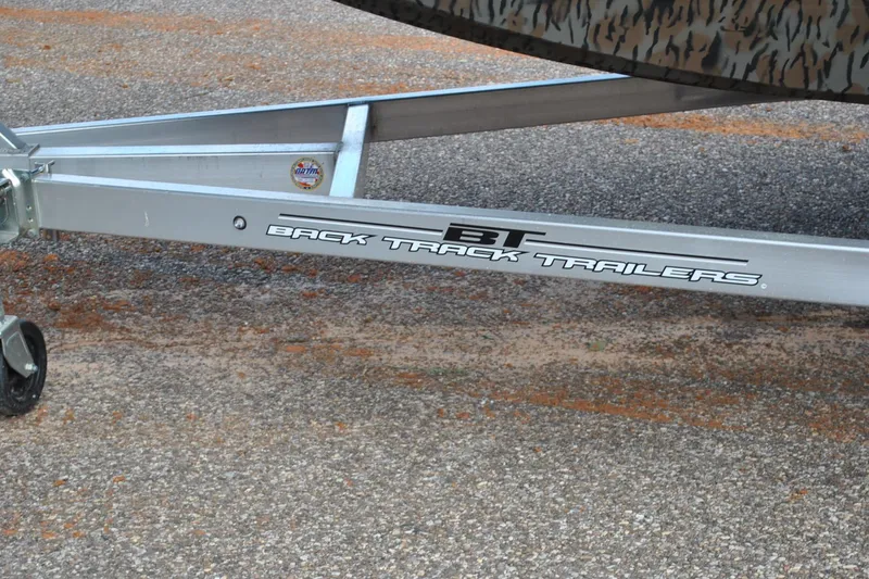 Slide: The Image of Trailer frame labeled "Back Track Trailers" on pavement, Express 180XP 2024 model. - 25