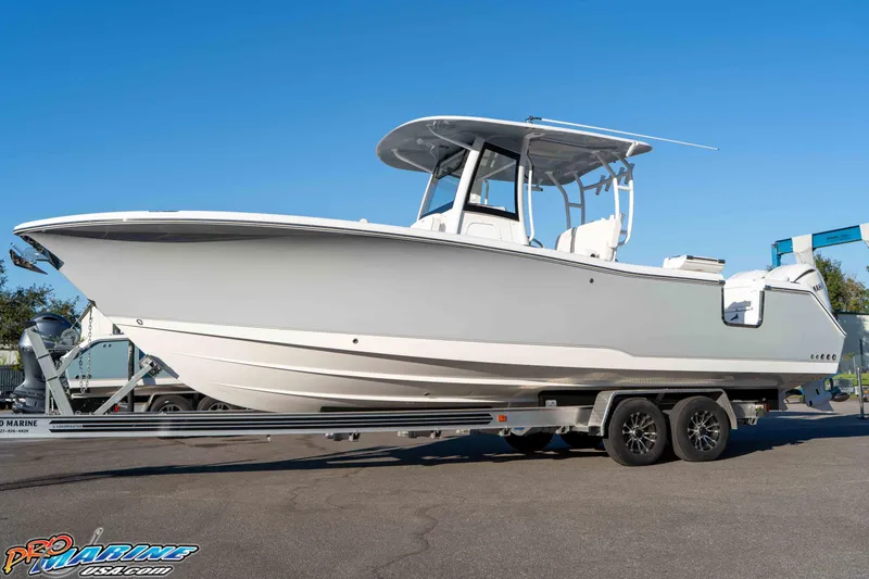Slide: The Image of 2026 Sea Hunt Ultra 285 SE boat on trailer, clear sky background. - 24