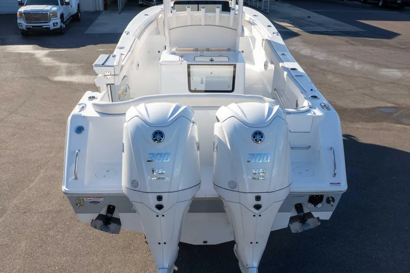 Slide: The Image of 2026 Sea Hunt Ultra 285 SE boat with dual 300 HP engines, rear view. - 27