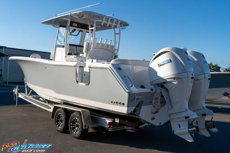 Slide: The Image of 2026 Sea Hunt Ultra 285 SE boat on trailer with dual Yamaha engines. - 30