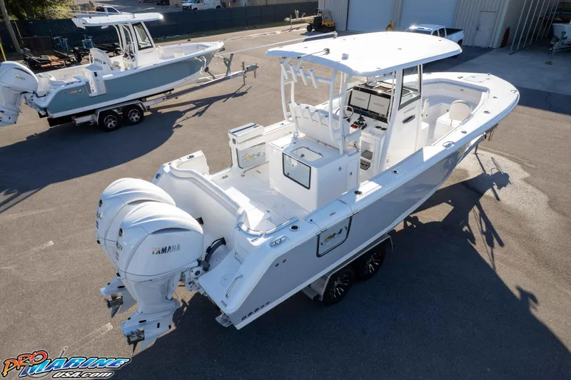 Slide: The Image of 2026 Sea Hunt Ultra 285 SE boat with dual Yamaha engines on a trailer. - 35