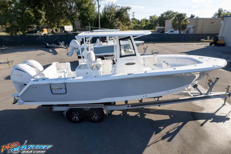 Slide: The Image of 2026 Sea Hunt Ultra 285 SE boat on trailer, parked outdoors. - 39