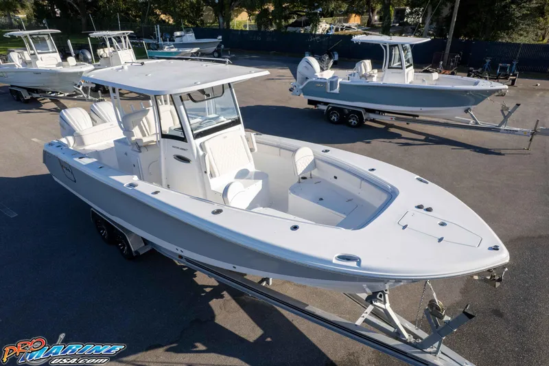 Slide: The Image of 2026 Sea Hunt Ultra 285 SE boat on trailer in outdoor showroom. - 4