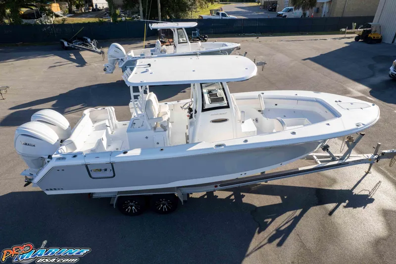 Slide: The Image of 2026 Sea Hunt Ultra 285 SE boat on trailer, featuring dual Yamaha engines. - 41