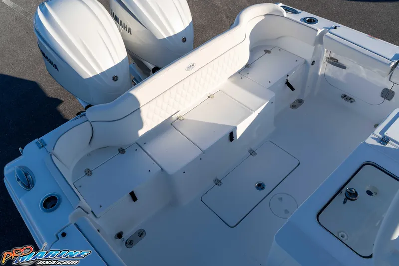 Slide: The Image of 2026 Sea Hunt Ultra 285 SE boat interior with Yamaha engines, featuring spacious seating and storage. - 44