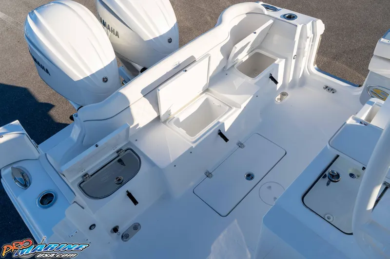 Slide: The Image of 2026 Sea Hunt Ultra 285 SE boat deck with Yamaha engines, featuring storage compartments. - 45