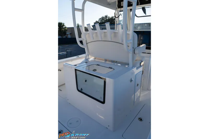 Slide: The Image of 2026 Sea Hunt Ultra 285 SE boat interior with seating and storage compartment. - 46