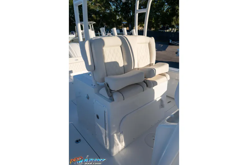 Slide: The Image of 2026 Sea Hunt Ultra 285 SE boat seating with cushioned armrests and backrests. - 47