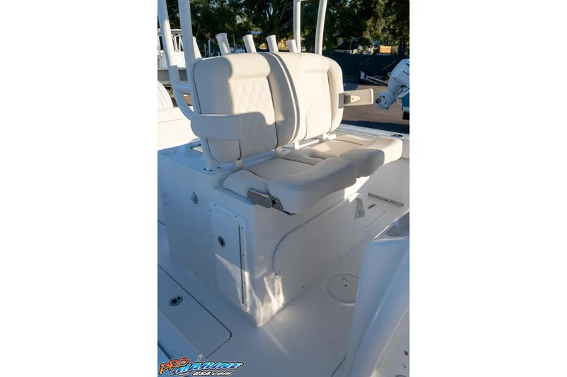 Slide: The Image of 2026 Sea Hunt Ultra 285 SE boat interior with cushioned seating and storage compartments. - 48