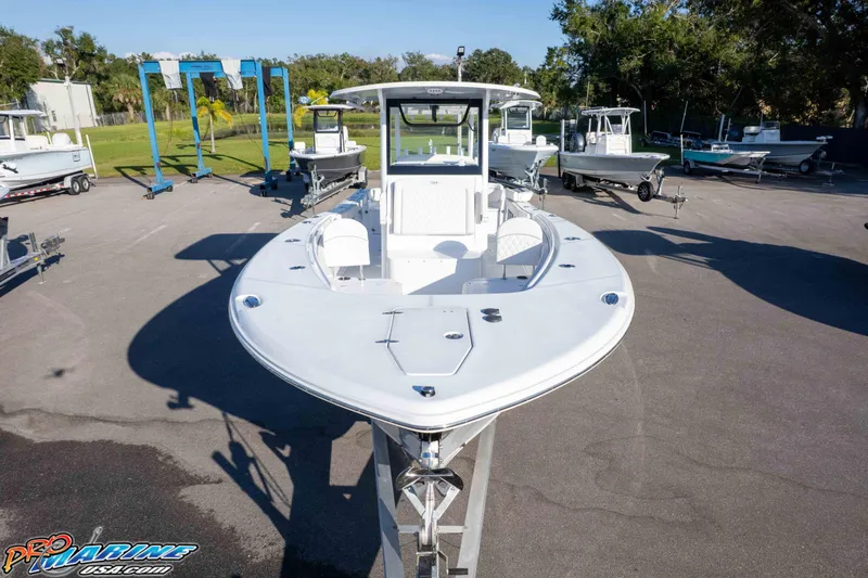 Slide: The Image of 2026 Sea Hunt Ultra 285 SE boat displayed in a marina setting. - 6