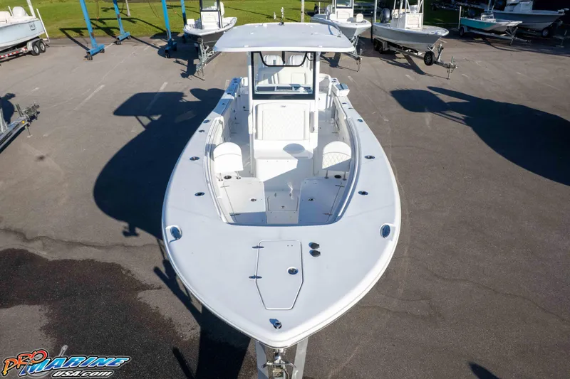 Slide: The Image of 2026 Sea Hunt Ultra 285 SE boat displayed in a marina setting. - 7