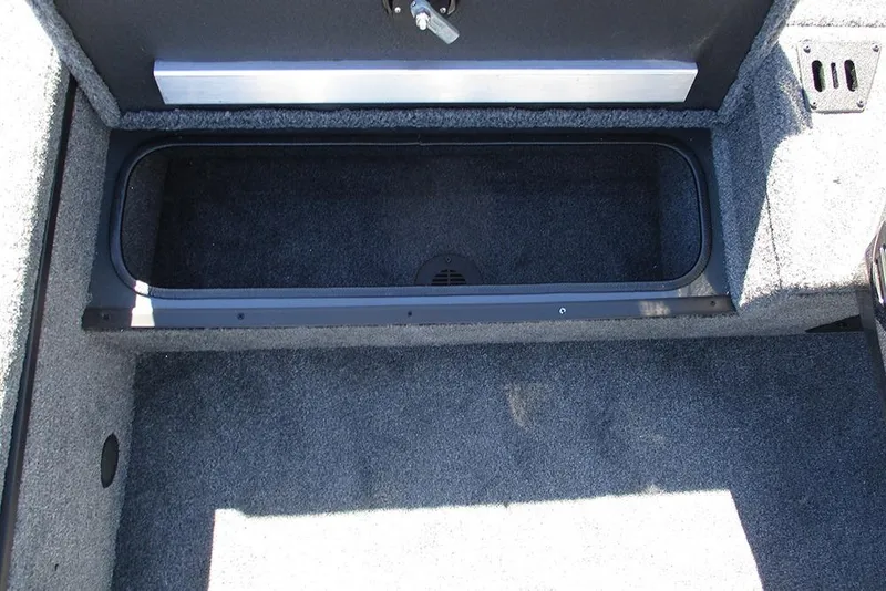 Slide: The Image of 2026 Ranger RT178 boat storage compartment with open lid, showcasing interior space. - 17