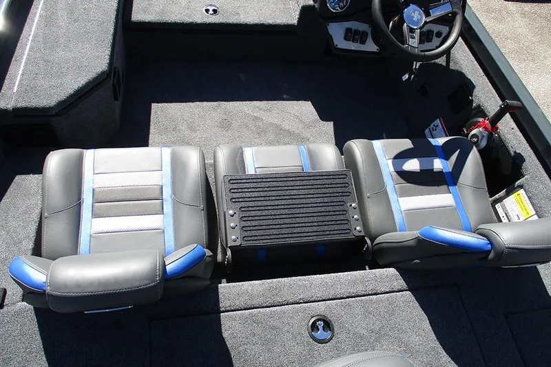 Slide: The Image of 2026 Ranger RT178 boat interior with gray and blue seating, steering wheel, and motor. - 19