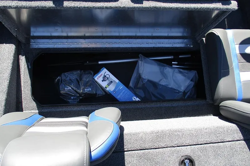 Slide: The Image of 2026 Ranger RT178 boat interior with storage compartment and steering console. - 21