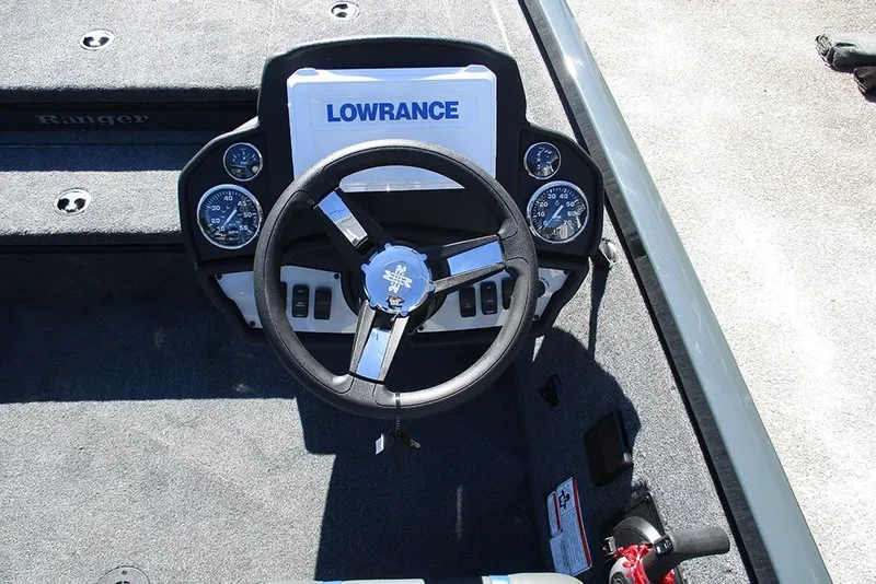 Slide: The Image of 2026 Ranger RT178 boat storage compartment with open lid, showcasing interior space. - 29