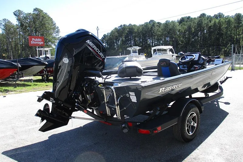 Slide: The Image of 2026 Ranger RT178 boat with Mercury engine on trailer, parked outdoors. - 7