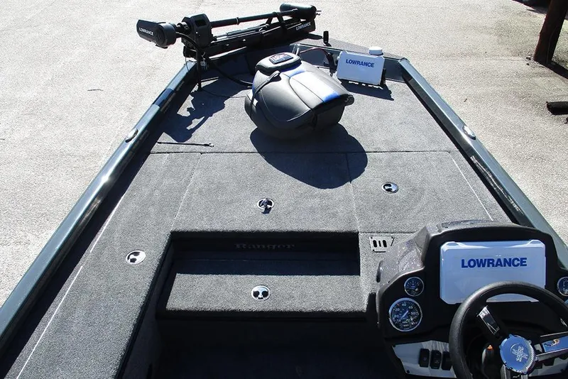 Slide: The Image of 2026 Ranger RT178 boat rear view with outboard motor and trailer in a dealership lot. - 9