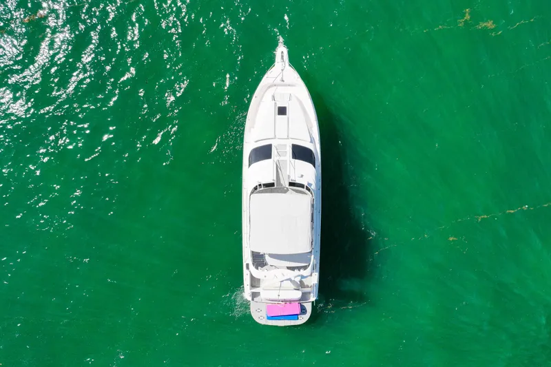 Slide: The Image of Aerial view of 2000 Sea Ray 450 Express Bridge yacht on vibrant green water. - 11