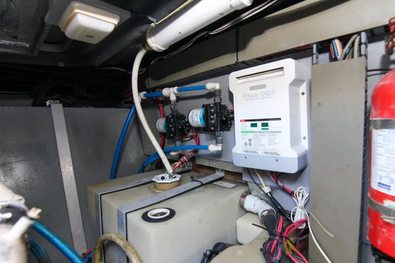 Slide: The Image of Engine room of 2000 Sea Ray 450 Express Bridge with ProNautic charger and wiring. - 14