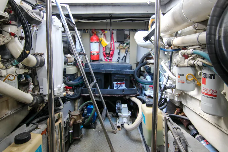 Slide: The Image of Engine room of 2000 Sea Ray 450 Express Bridge with visible machinery and equipment. - 17