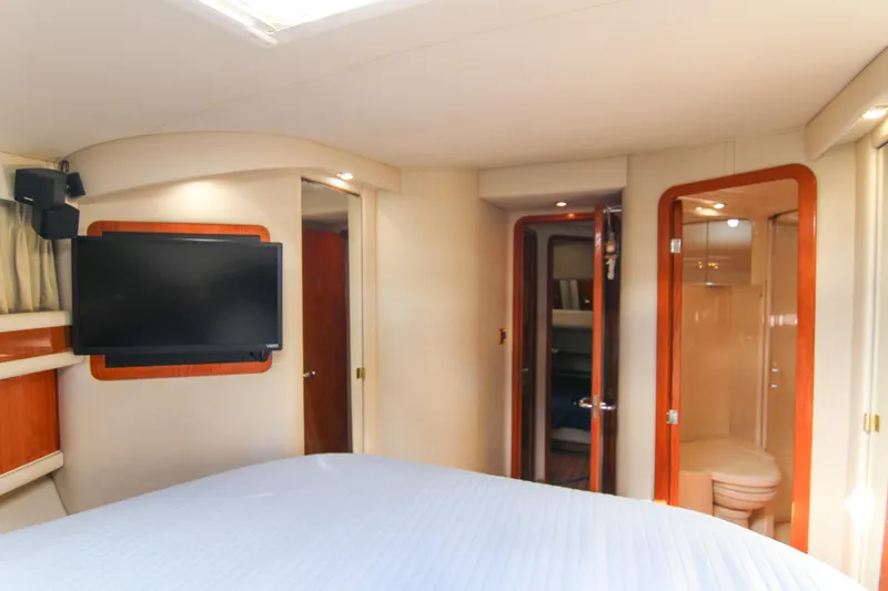 Slide: The Image of Interior of 2000 Sea Ray 450 Express Bridge with TV and ensuite bathroom. - 23