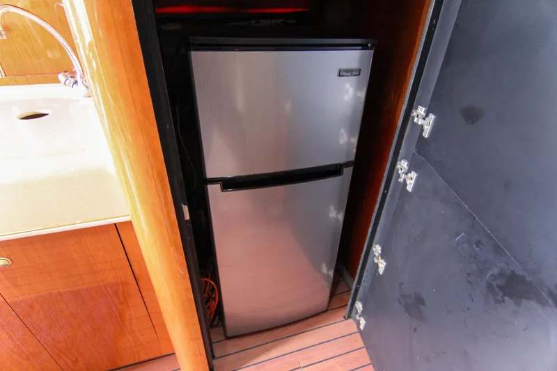 Slide: The Image of Stainless steel fridge in 2000 Sea Ray 450 Express Bridge yacht kitchen. - 27