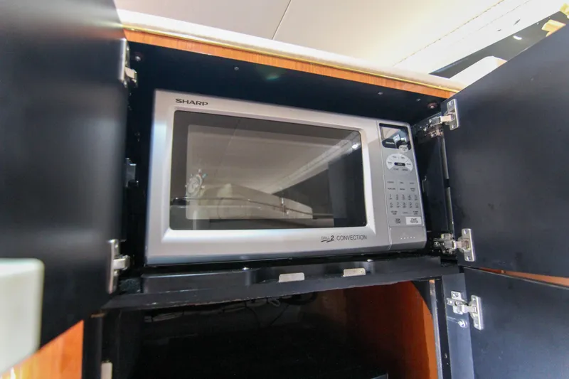 Slide: The Image of Microwave in 2000 Sea Ray 450 Express Bridge yacht kitchen cabinet. - 28