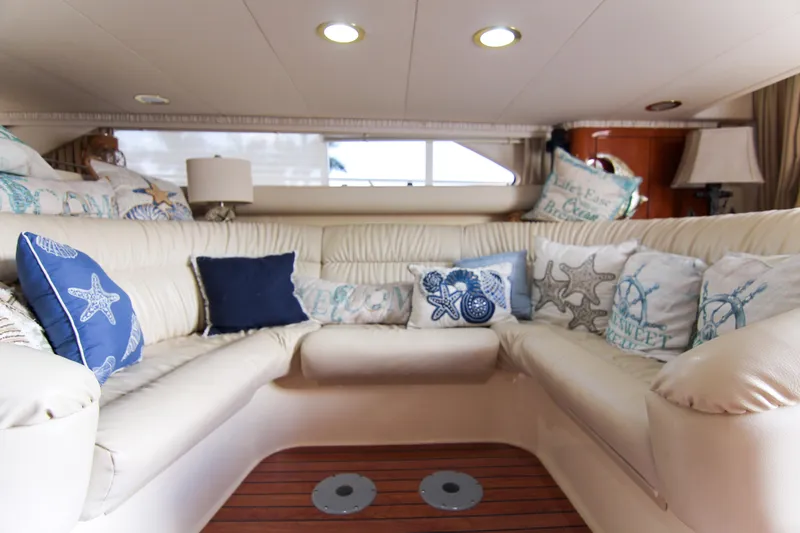 Slide: The Image of Luxurious interior of 2000 Sea Ray 450 Express Bridge with nautical-themed cushions. - 31