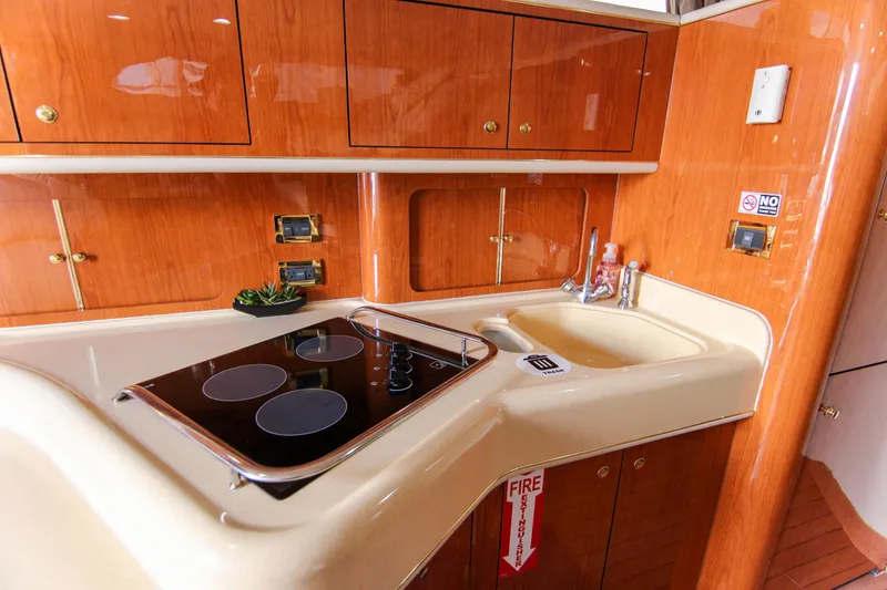 Slide: The Image of Luxurious kitchen area in 2000 Sea Ray 450 Express Bridge yacht. - 34