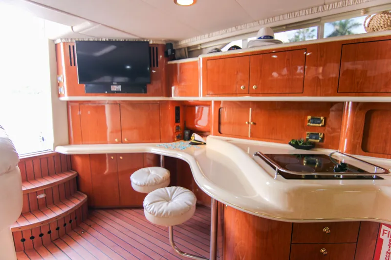 Slide: The Image of Luxurious interior of 2000 Sea Ray 450 Express Bridge yacht with modern amenities. - 35