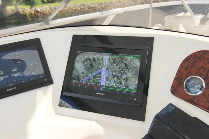 Slide: The Image of Garmin navigation screens on 2000 Sea Ray 450 Express Bridge yacht dashboard. - 38