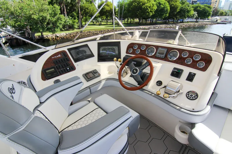 Slide: The Image of 2000 Sea Ray 450 Express Bridge helm with modern controls and luxurious seating. - 39